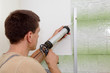 Photo: Plumber using silicone cartridge Plumber using silicone cartridge