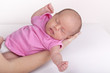 mother holding newborn baby girl