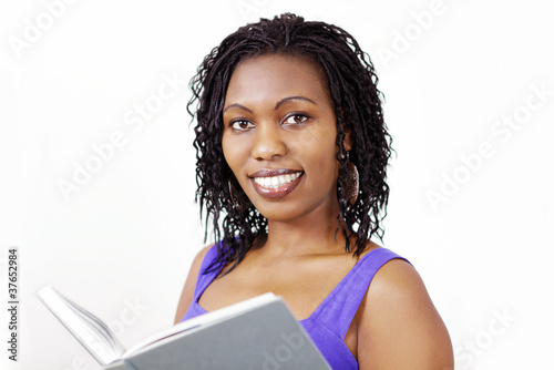Photo: Portrait of a lovely smiling woman with book Portrait of a lovely smiling woman with book