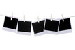 Photo paper hanging on the clothesline isolated on white