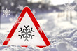 Eis - Warnschild mit Schnee