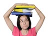 Pressure of studies is seen on girl's face.