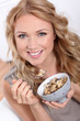 Photo: Portrait of beautiful woman eating cereals Portrait of beautiful woman eating cereals