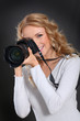 Portrait of professional photographer holding photo camera Portrait of professional photographer holding photo camera