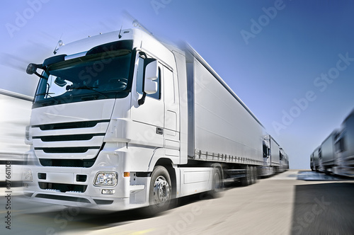 Photo: Modern Truck on road added motion blur Modern Truck on road added motion blur