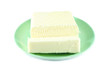 butter on a green saucer butter on a green saucer