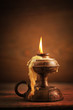 Photo: old candle on a wooden table old candle on a wooden table