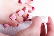 female feet red polished nails