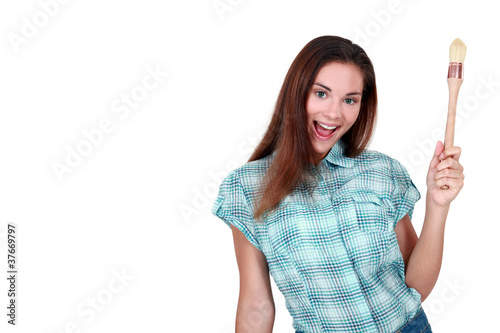 Photo: beautiful woman holding a brush beautiful woman holding a brush