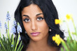 Lovely young woman with flower plants