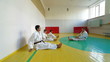Martial arts instructor training  students
