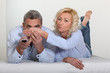 Couple watching television together