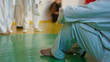 Karate coach with children in gym