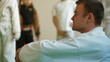 Karate coach with children in gym