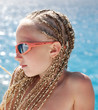 The girl in pink glasses with the African plaits. A portrait