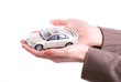 Woman's hands holding the model of car Woman's hands holding the model of car