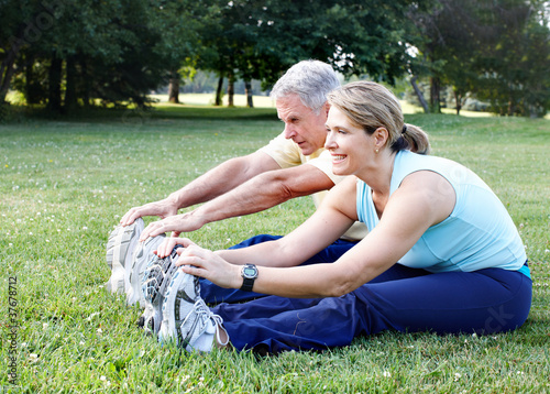Photo: Senior couple doing yoga. Senior couple doing yoga.