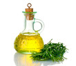Oil in a bottle and fresh rosemary isolated on white