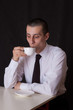 surprised businessman drinking coffee surprised businessman drinking coffee