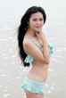 young girl sit in the seaside