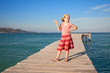 little girl on the bridge against the sea little girl on the bridge against the sea