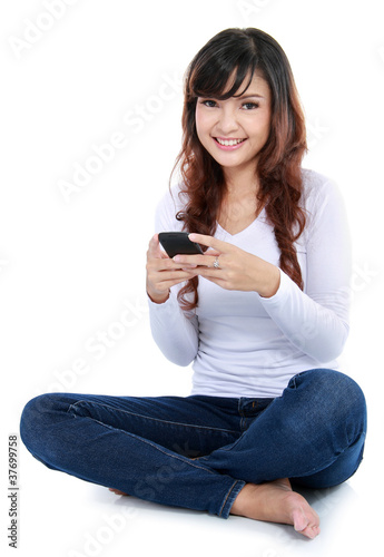 Photo: Woman text messaging Woman text messaging