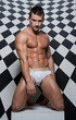 Photo: Muscle sexy naked young man is kneeling Muscle sexy naked young man is kneeling