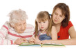 Grandmother with the grand daughter read the book