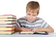 The boy reads the book isolated on white