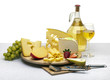Cheese still life on a wooden round tray