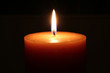 Photo: Candle on a black background Candle on a black background