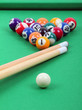 balls and sticks on green billiards table,  lighting from above