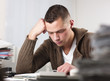 Businessman reading documents at office