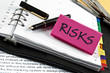 Risks note on agenda and pen
