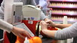 Paying for goods at checkout counter