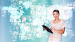 Portrait of young woman holding her tablet computer and communic