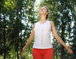 Photo: Young girl in a white shirt and red pants Young girl in a white shirt and red pants