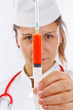 Doctor holding syringe