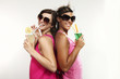 two girls in studio, white background, portrait