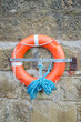 life ring on brick habour wall