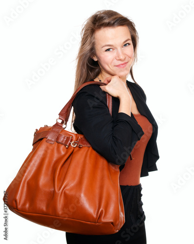 Photo: Young smiling woman with handbag Young smiling woman with handbag