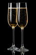 Two glasses of champagne on  black background