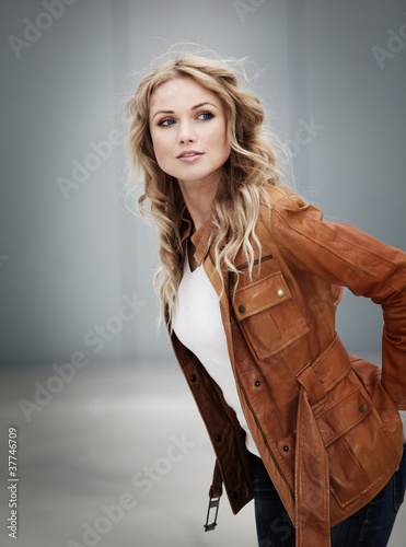 Photo: Portrait of beautiful blond woman with leather jacket Portrait of beautiful blond woman with leather jacket