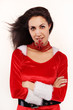 Attractive adult Santa girl with snowflake