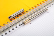 fountain pen and  writing-book on a spiral