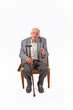 elderly man sitting in his armchair with walking stick elderly man sitting in his armchair with walking stick