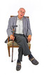 elderly man sitting in his armchaior with walking stick elderly man sitting in his armchaior with walking stick