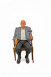 old man sitting in the armchair with his walking stick old man sitting in the armchair with his walking stick