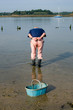 man looking for shellfish