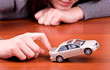 Woman's hand holding the model of car Woman's hand holding the model of car